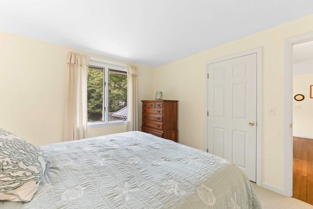 11 Oval Road Chatham, MA 02633 - Photo 11 of 35 a bedroom with a bed and a dresser