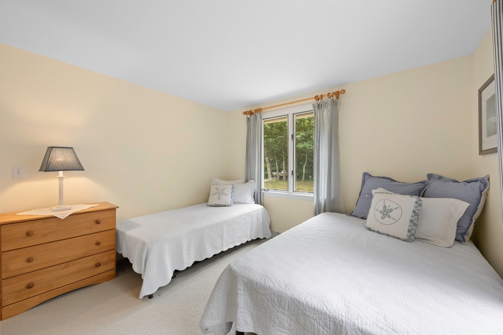 11 Oval Road Chatham, MA 02633 - Photo 12 of 35 a bedroom with two beds and large window