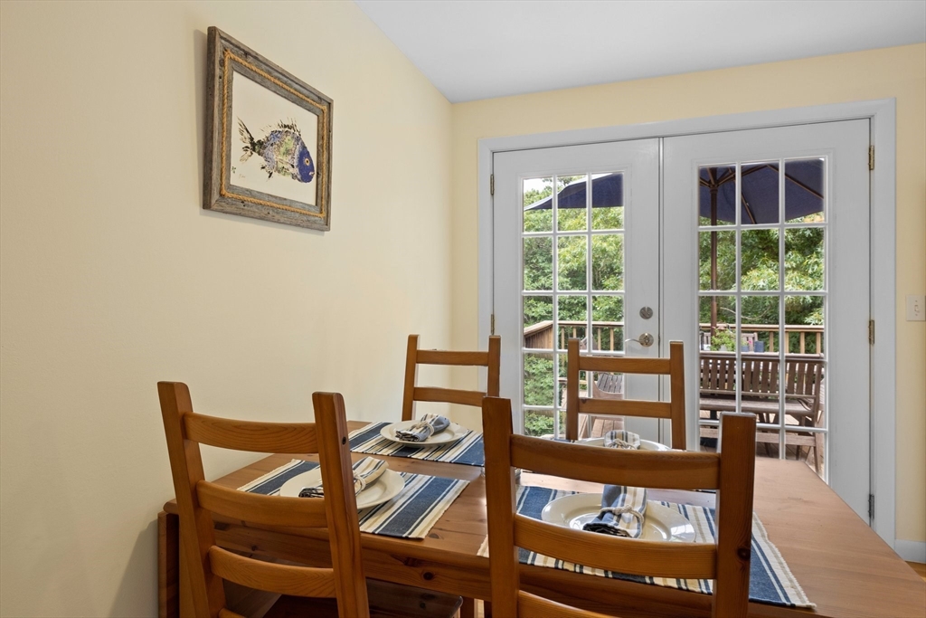 11 Oval Road Chatham, MA 02633 - Photo 15 of 35 a view of a dining room with furniture and a window