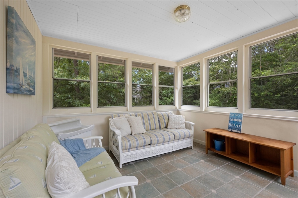 11 Oval Road Chatham, MA 02633 - Photo 19 of 35 a living room with furniture and a large window