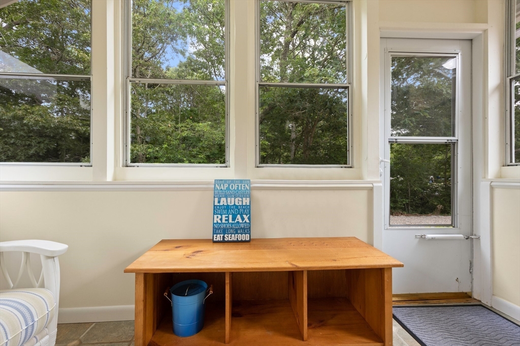 11 Oval Road Chatham, MA 02633 - Photo 20 of 35 a view of a room that has a window and a table in it