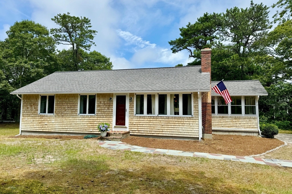 11 Oval Road Chatham, MA 02633 - Photo 2 of 35 a front view of a house with a yard