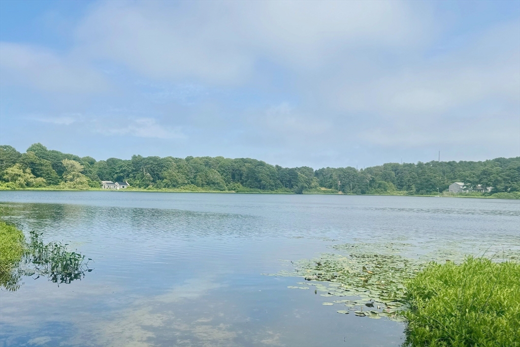 11 Oval Road Chatham, MA 02633 - Photo 31 of 35 a view of a lake with houses in the back