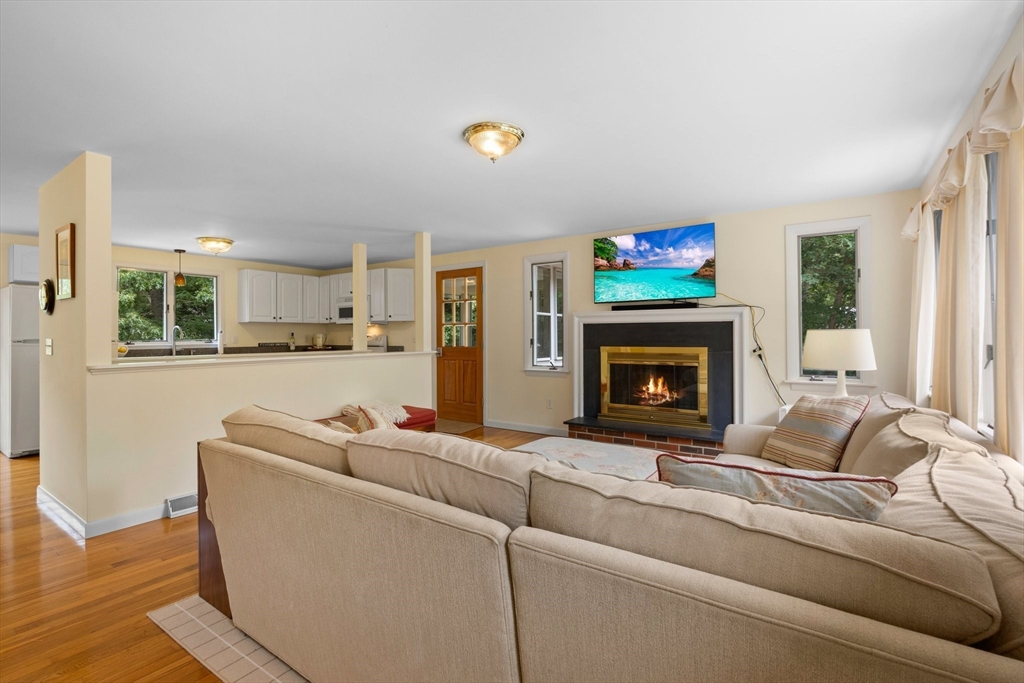11 Oval Road Chatham, MA 02633 - Photo 5 of 35 a living room with furniture and a fireplace