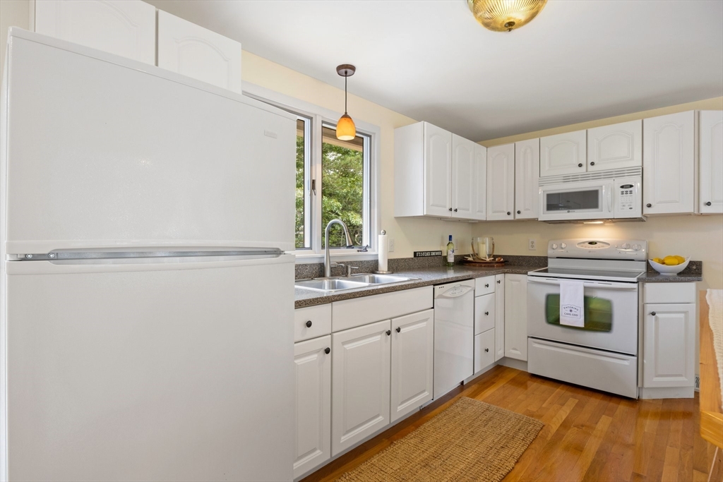 11 Oval Road Chatham, MA 02633 - Photo 8 of 35 a kitchen with a sink cabinets and window