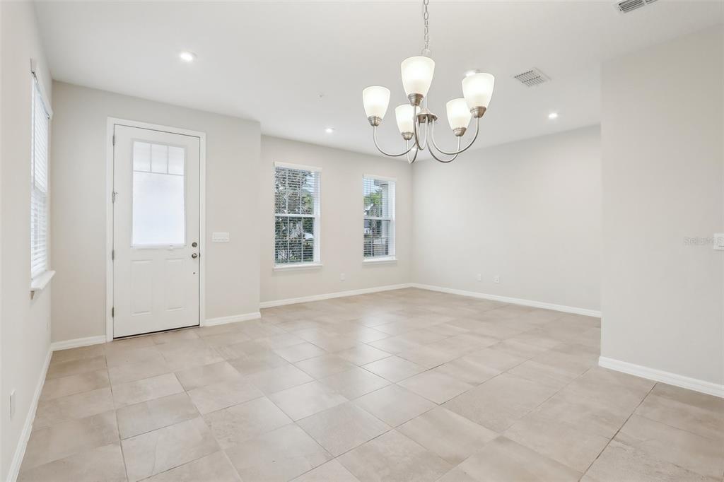 9457 Randal Park Boulevard Orlando, FL 32832 - Photo 11 of 52 an empty room with kitchen view