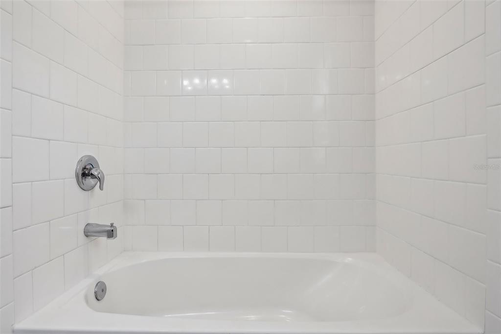9457 Randal Park Boulevard Orlando, FL 32832 - Photo 25 of 52 a bathroom with a bathtub