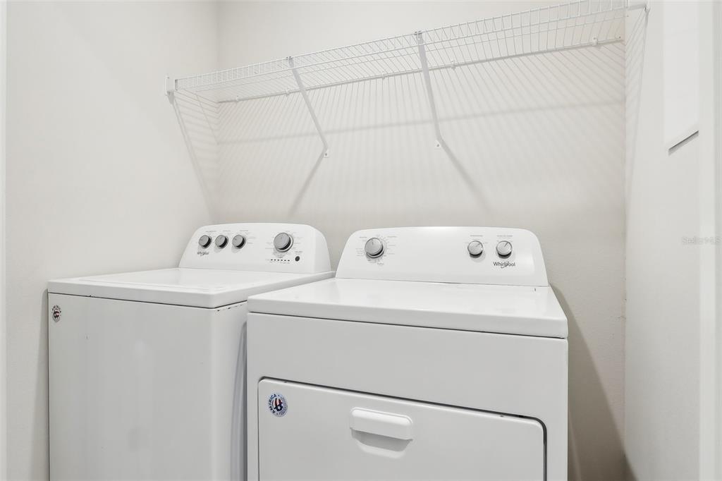 9457 Randal Park Boulevard Orlando, FL 32832 - Photo 26 of 52 a utility room with dryer and washer