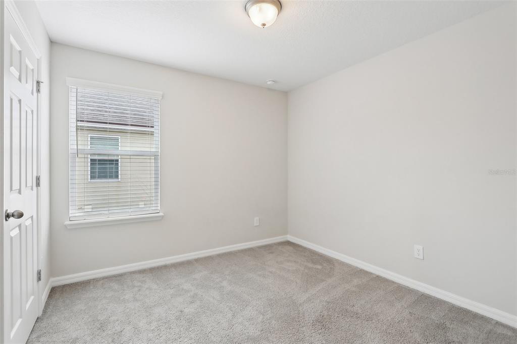 9457 Randal Park Boulevard Orlando, FL 32832 - Photo 28 of 52 a view of an empty room with a window