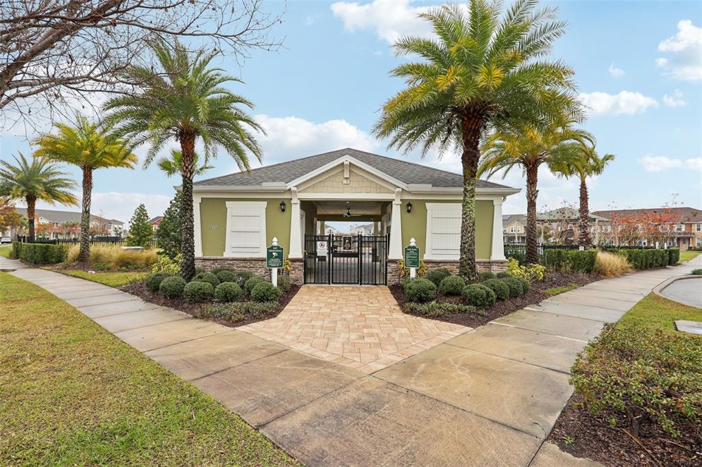 9457 Randal Park Boulevard Orlando, FL 32832 - Photo 40 of 52 a front view of house with yard and green space
