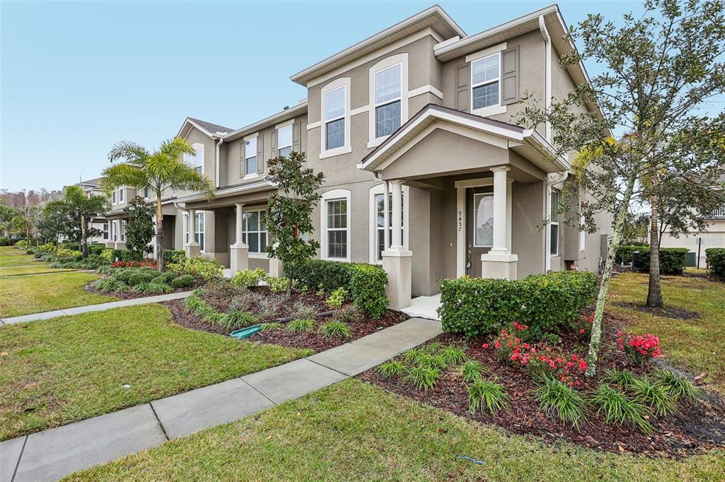 9457 Randal Park Boulevard Orlando, FL 32832 - Photo 4 of 52 a front view of a house with garden