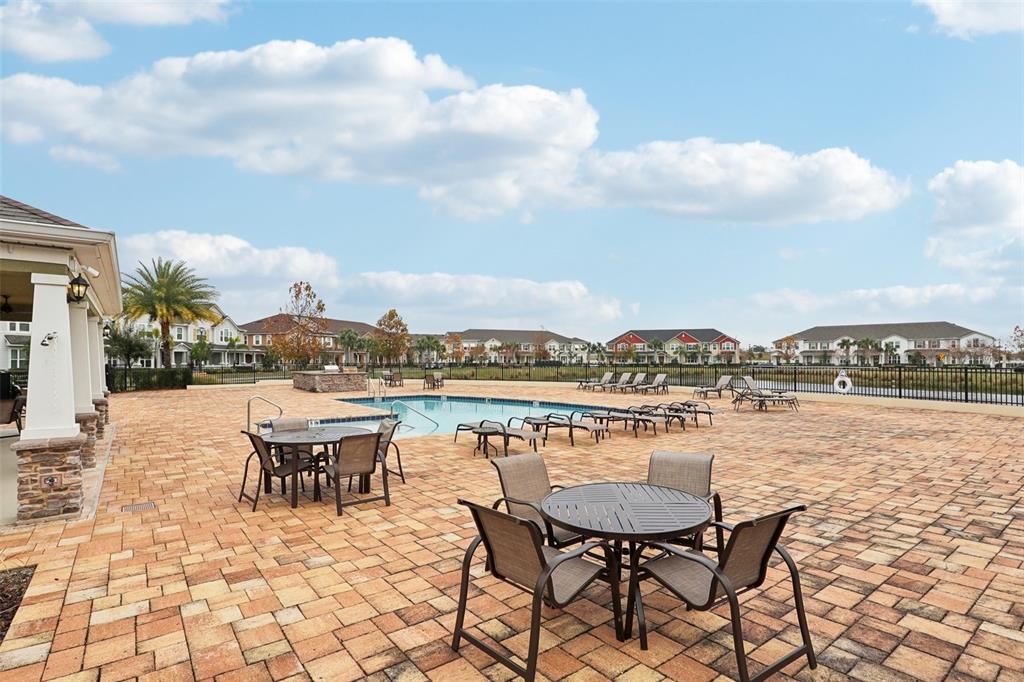 9457 Randal Park Boulevard Orlando, FL 32832 - Photo 43 of 52 a view of a terrace with outdoor seating