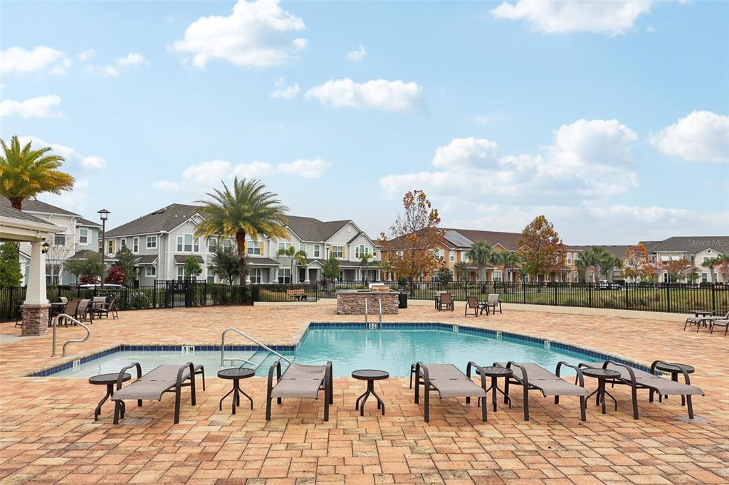 9457 Randal Park Boulevard Orlando, FL 32832 - Photo 44 of 52 a view of swimming pool with outdoor seating and city view