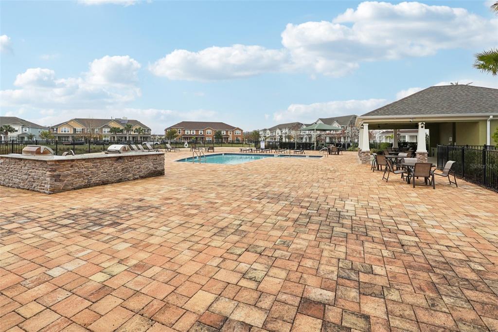 9457 Randal Park Boulevard Orlando, FL 32832 - Photo 47 of 52 a view of swimming pool with lawn chairs and iron fence