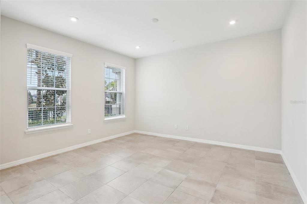 9457 Randal Park Boulevard Orlando, FL 32832 - Photo 7 of 52 an empty room with a window