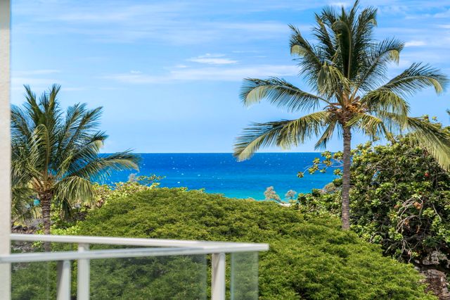 a view of swimming pool from a balcony