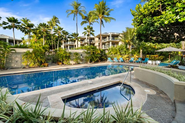 a view of swimming pool with a table and chairs