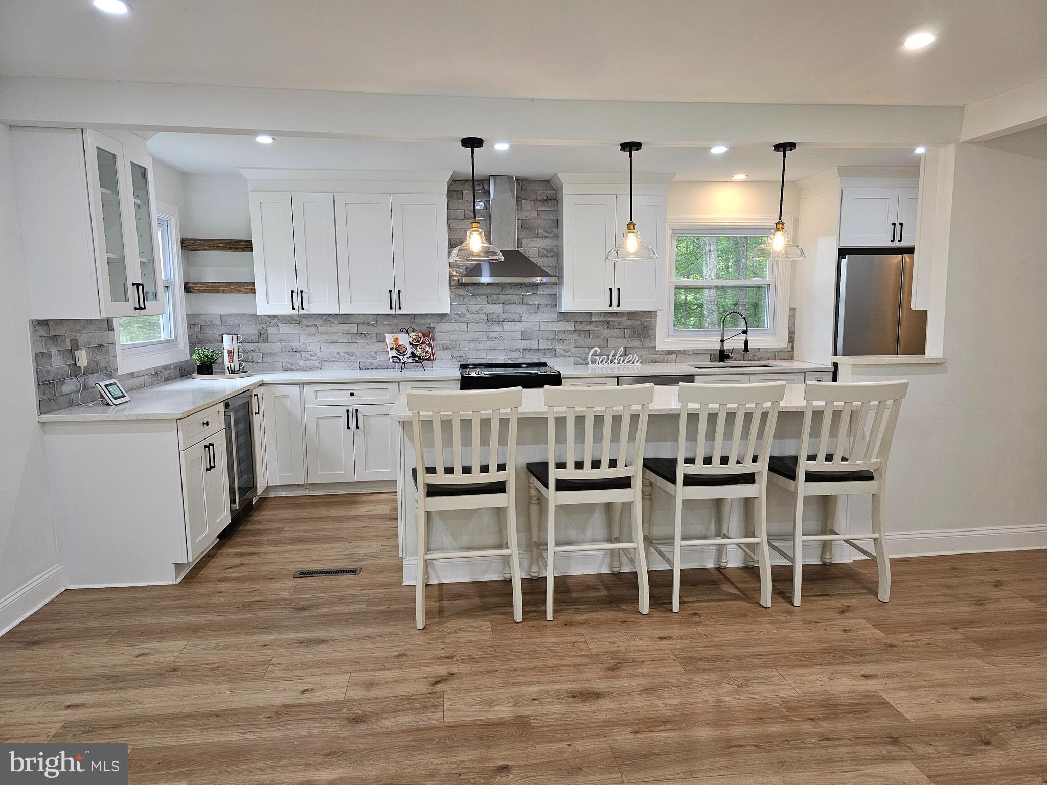 133 Meadows Road Fredericksburg, VA 22406 - Photo 14 of 55 a large kitchen with a table and chairs