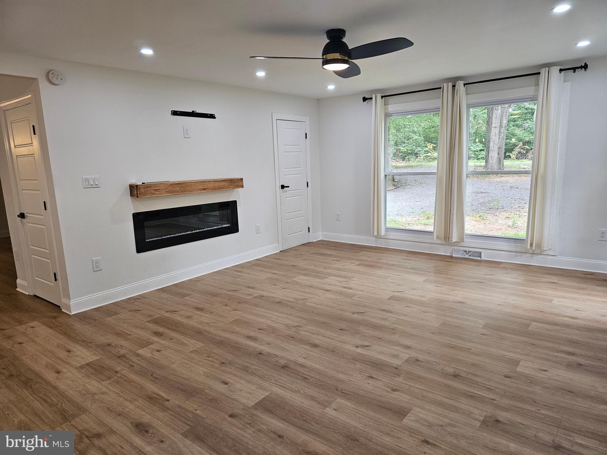 133 Meadows Road Fredericksburg, VA 22406 - Photo 17 of 55 a view of empty room with wooden floor and fan