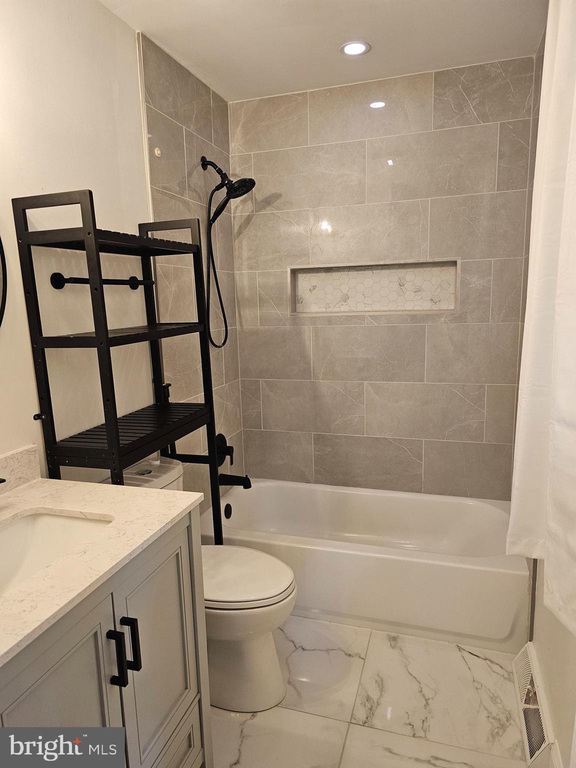 133 Meadows Road Fredericksburg, VA 22406 - Photo 23 of 55 a bathroom with a sink a toilet and shower