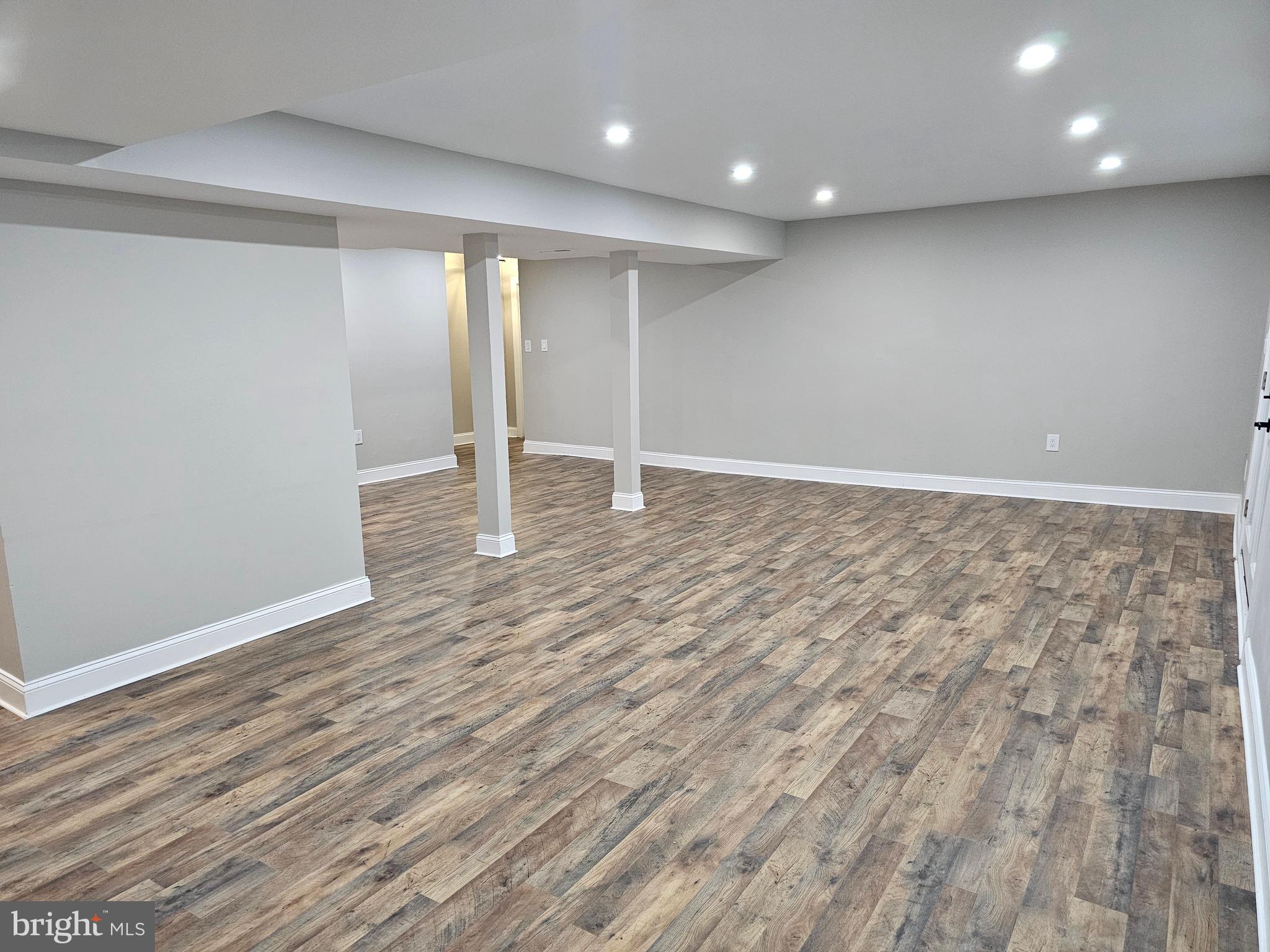 133 Meadows Road Fredericksburg, VA 22406 - Photo 34 of 55 an empty room with wooden floor and natural light