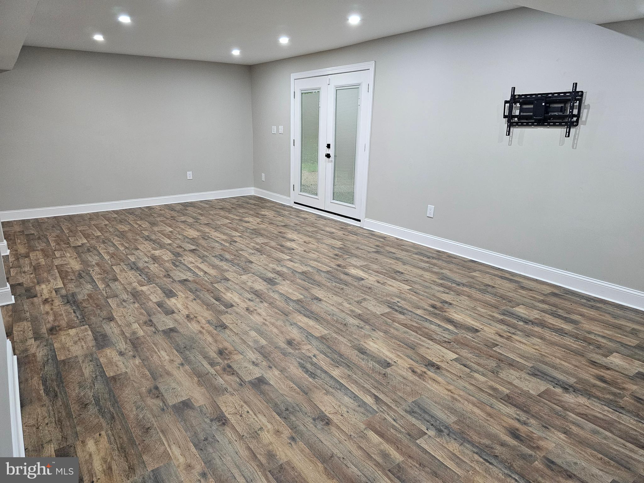 133 Meadows Road Fredericksburg, VA 22406 - Photo 35 of 55 an empty room with wooden floor and windows