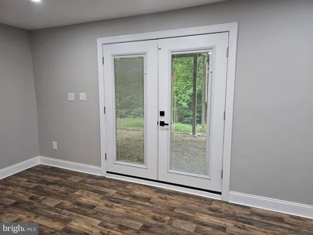 a white toilet sitting next to a bathroom sink