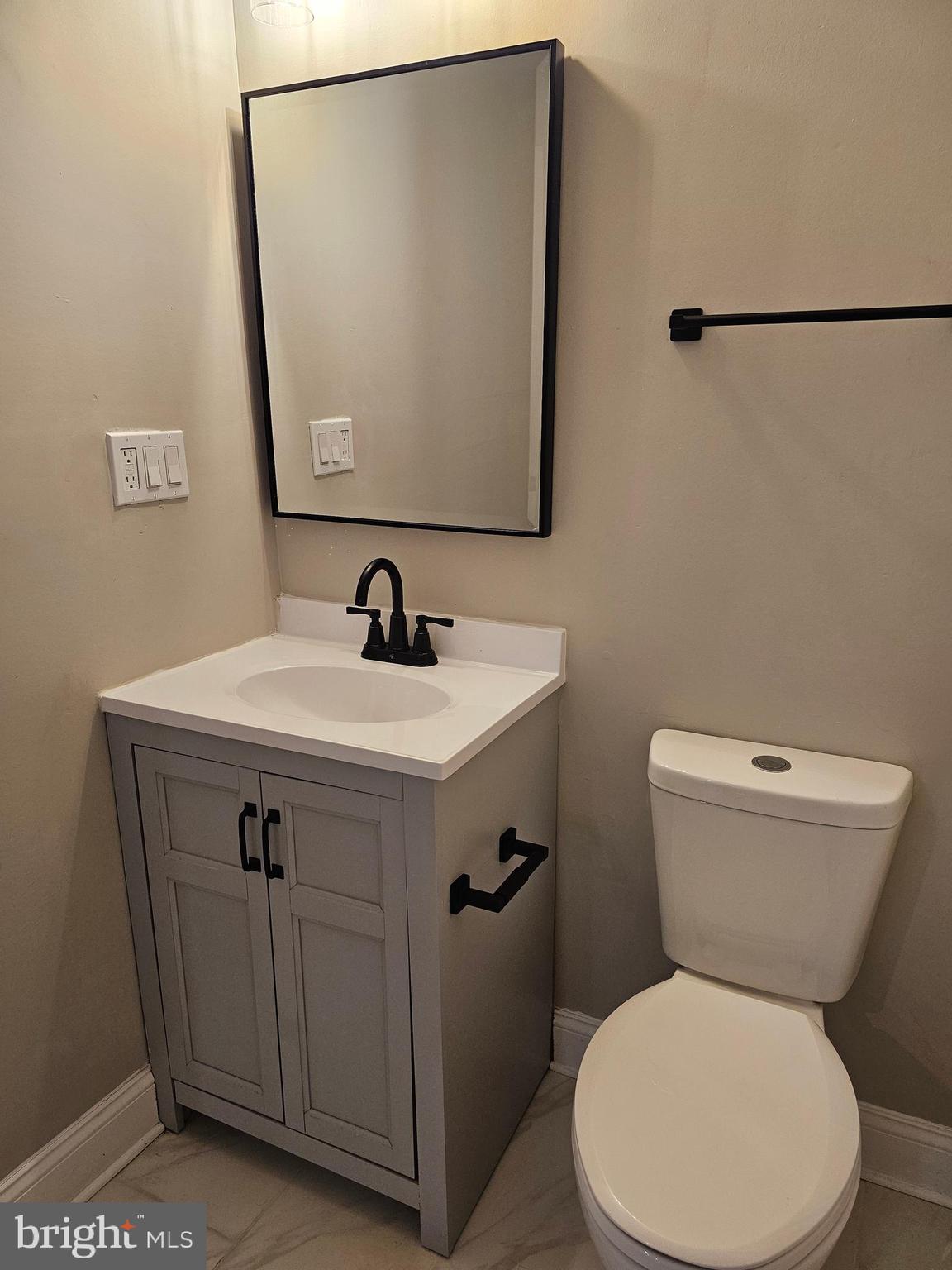 133 Meadows Road Fredericksburg, VA 22406 - Photo 38 of 55 a white toilet sitting next to a bathroom sink