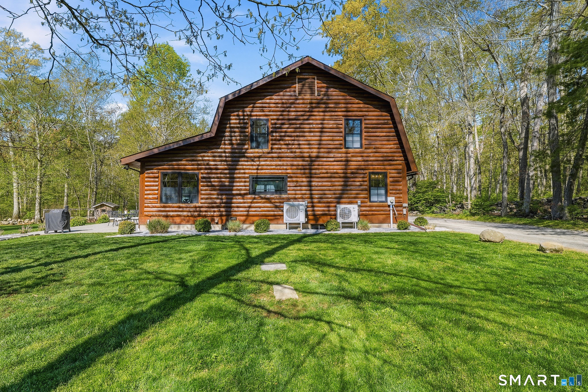 61 Mystic Road North Stonington, CT 06359 - Photo 34 of 40 a view of a house with a backyard