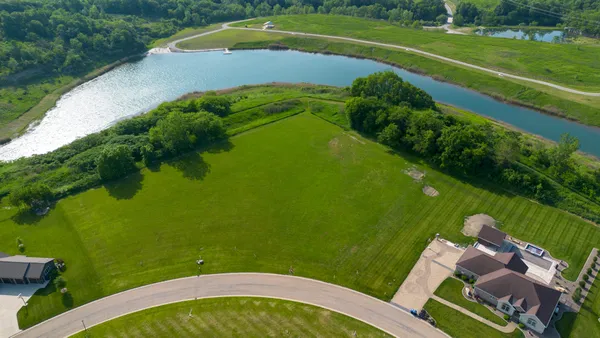 a view of a golf course with a lake view