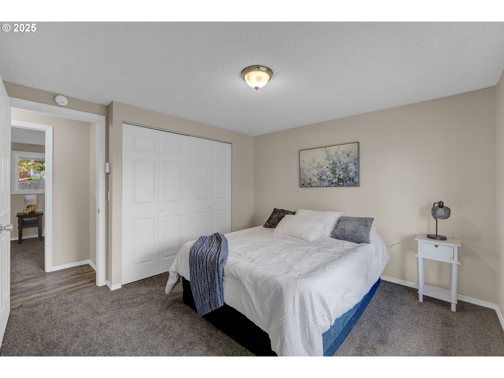 2015 Coventry Way Eugene, OR 97405 - Photo 29 of 48 a bedroom with a bed and a lamp