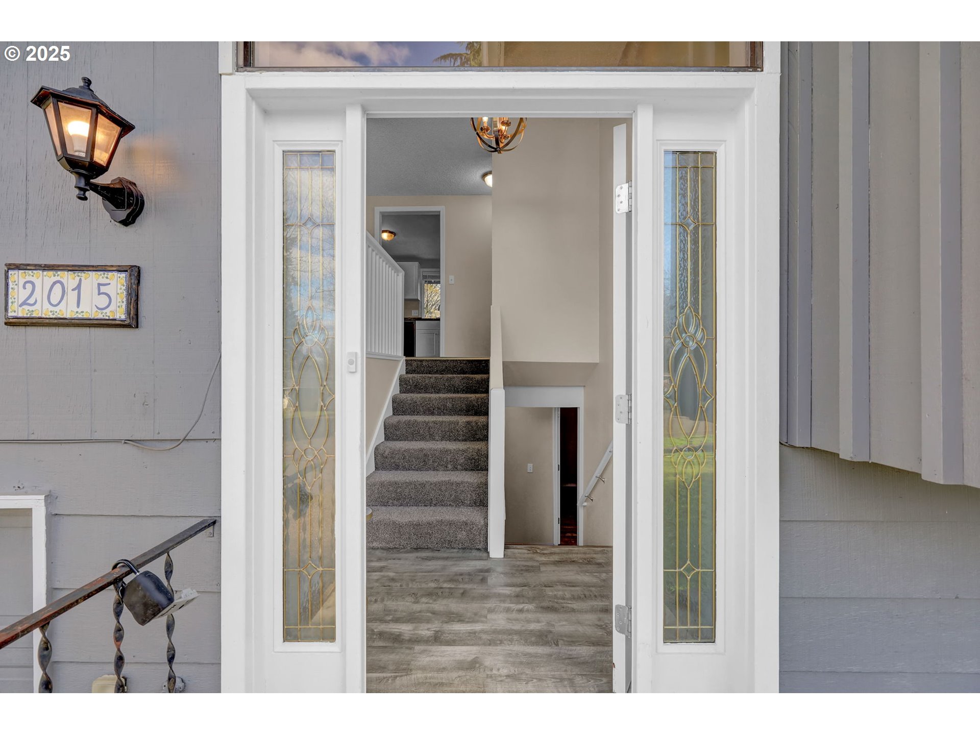 2015 Coventry Way Eugene, OR 97405 - Photo 3 of 48 a view of a hallway with wooden floor and staircase