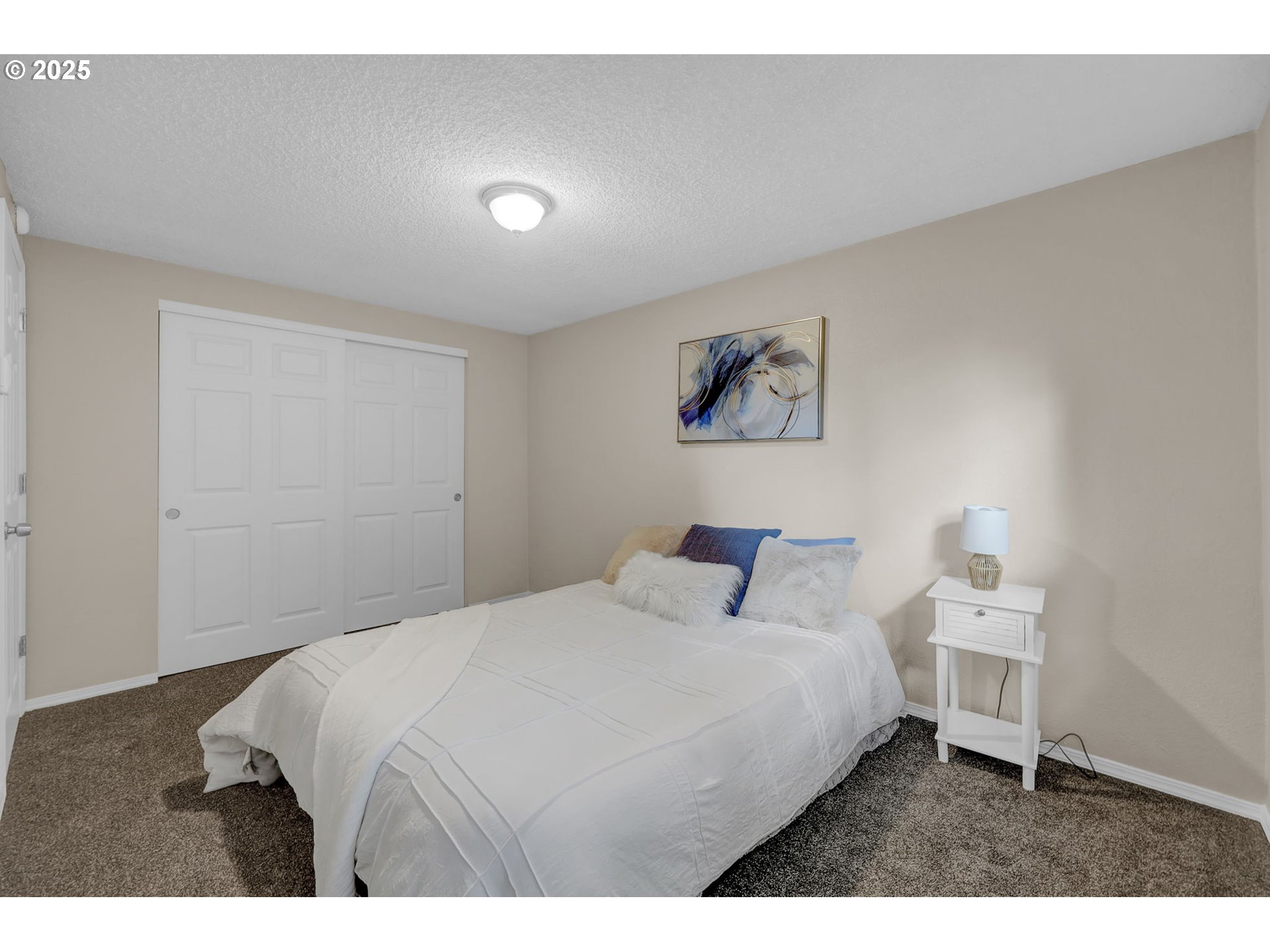 2015 Coventry Way Eugene, OR 97405 - Photo 35 of 48 a bedroom with a bed and a painting on the wall