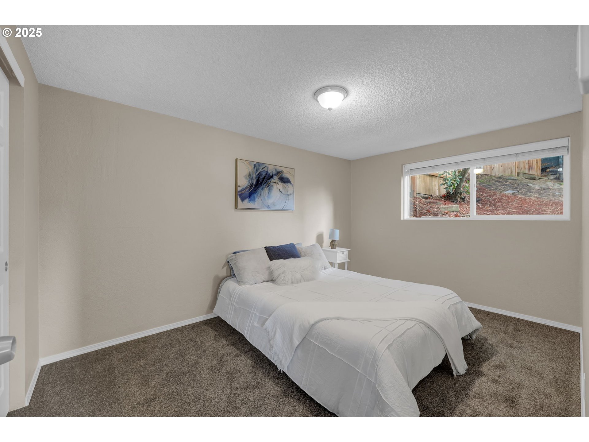 2015 Coventry Way Eugene, OR 97405 - Photo 36 of 48 a bedroom with a bed and a painting