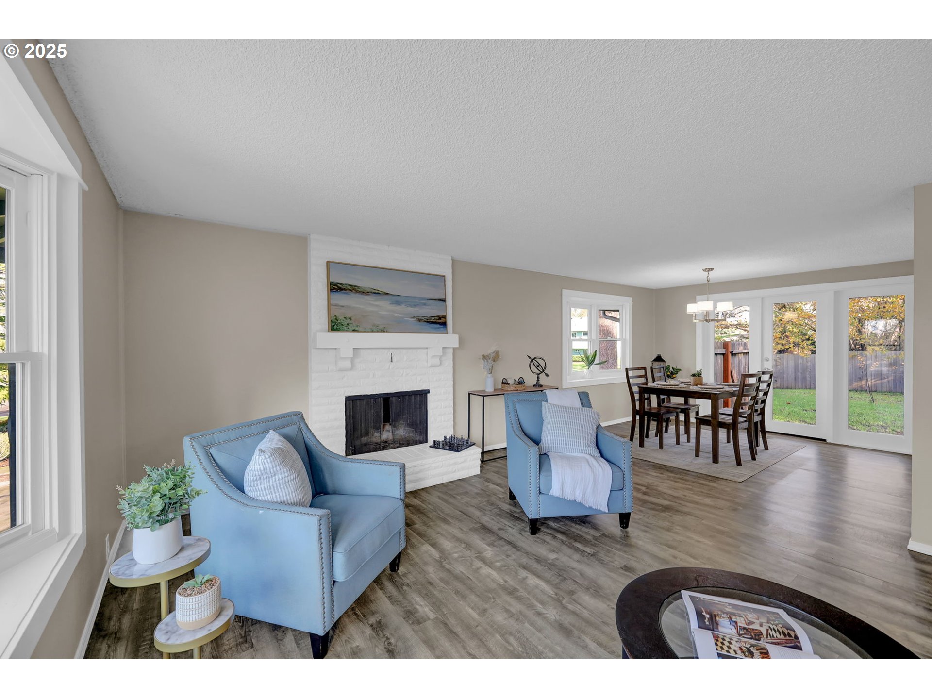 2015 Coventry Way Eugene, OR 97405 - Photo 10 of 48 a living room with fireplace furniture dining table and a fireplace