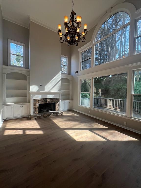 5455 Woodrun Lane Alpharetta, GA 30005 - Photo 14 of 71 a living room with fireplace furniture and a chandelier