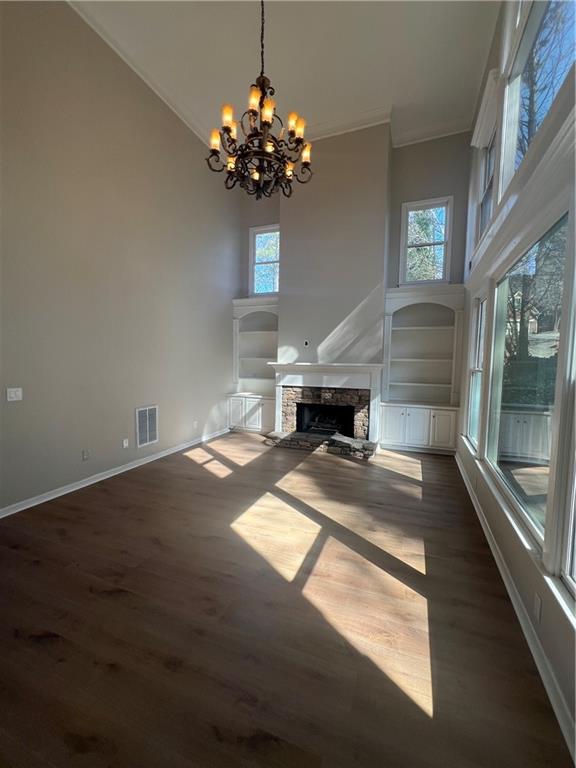 5455 Woodrun Lane Alpharetta, GA 30005 - Photo 15 of 71 a living room with fireplace furniture and a chandelier