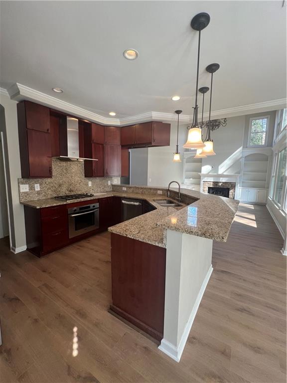 5455 Woodrun Lane Alpharetta, GA 30005 - Photo 20 of 71 a large kitchen with stainless steel appliances kitchen island granite countertop a sink a counter space and cabinets