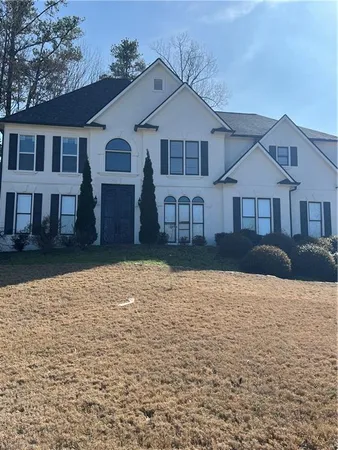 a front view of a house with yard