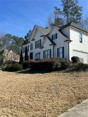 a front view of a house with a yard