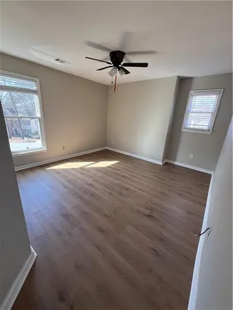a view of a brick house with a small yard