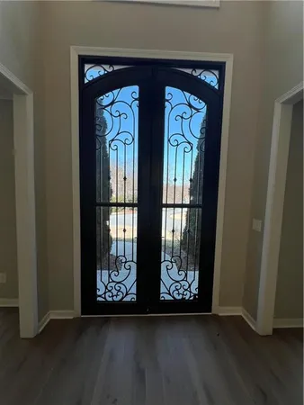 a view of front door with wooden floor