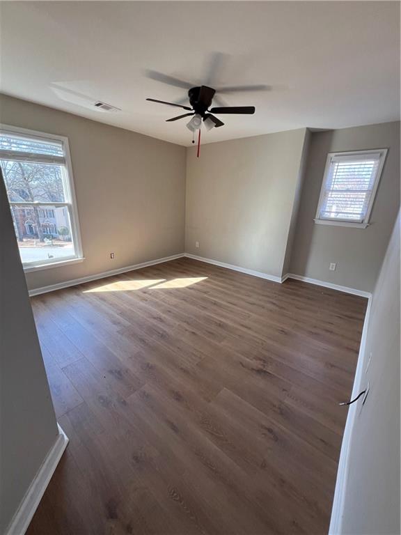 5455 Woodrun Lane Alpharetta, GA 30005 - Photo 51 of 71 an empty room with windows and fan