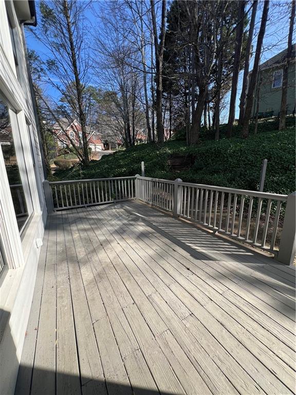 5455 Woodrun Lane Alpharetta, GA 30005 - Photo 67 of 71 a view of barbeque outdoor space with wooden fence
