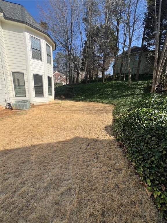 5455 Woodrun Lane Alpharetta, GA 30005 - Photo 68 of 71 a view of a yard with brick walls
