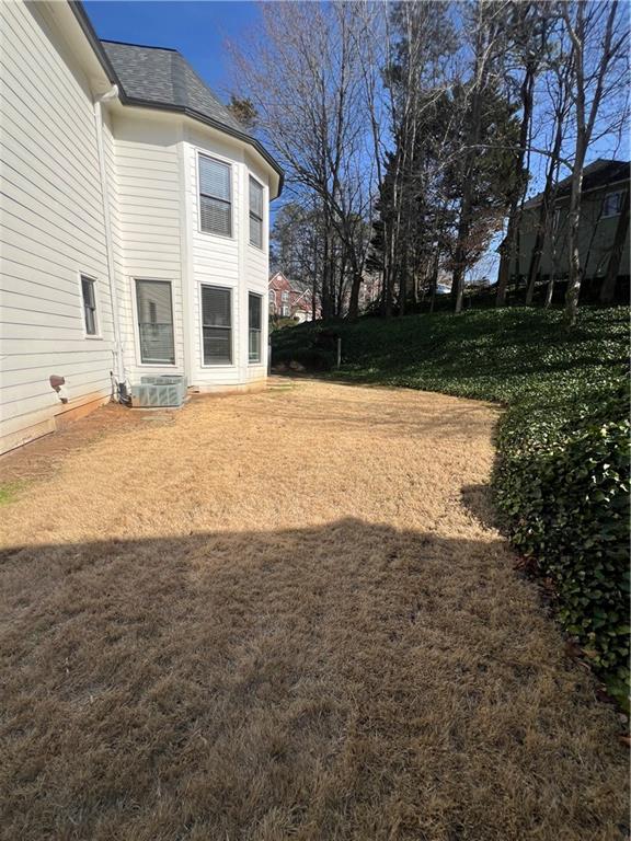 5455 Woodrun Lane Alpharetta, GA 30005 - Photo 69 of 71 a view of a yard in front of a house