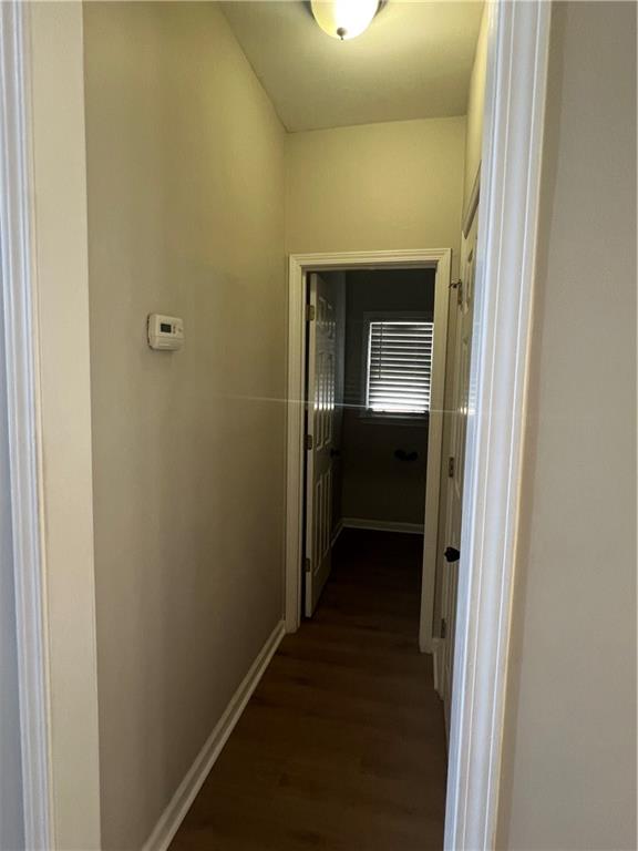 5455 Woodrun Lane Alpharetta, GA 30005 - Photo 9 of 71 a view of a hallway with wooden floor