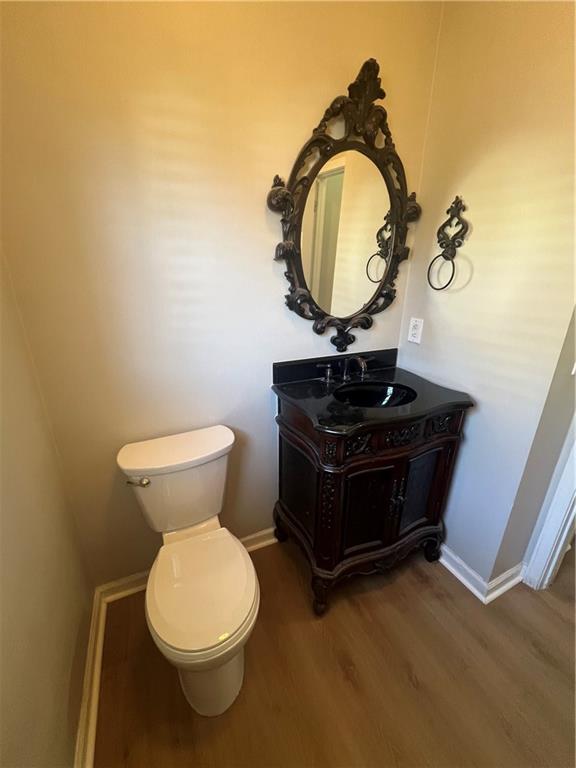 5455 Woodrun Lane Alpharetta, GA 30005 - Photo 10 of 71 a bathroom with a toilet and a mirror