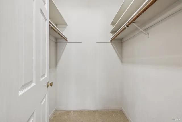 a bathroom with a granite countertop shower and a toilet