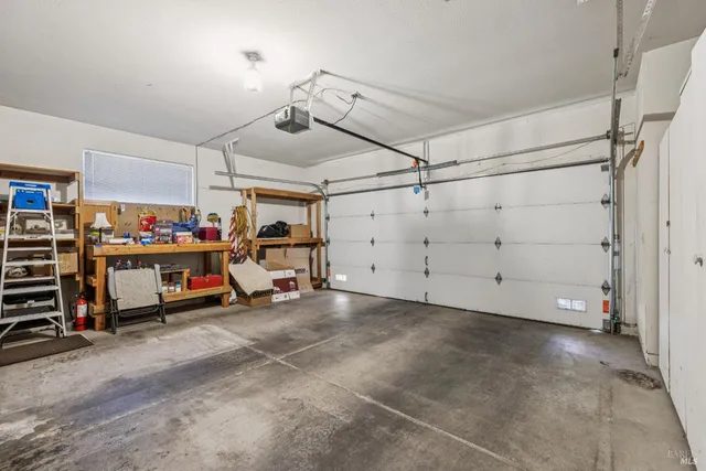 a view of storage and utility room with wooden floor